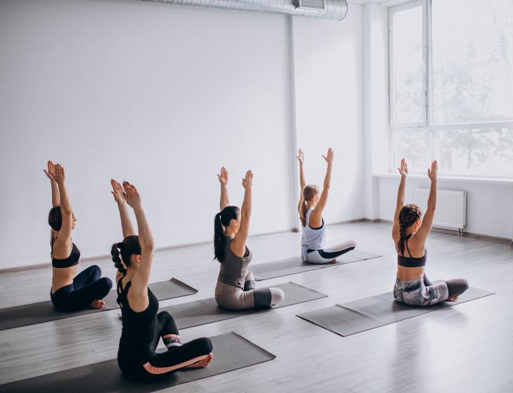 Yoga group classes inside the gym