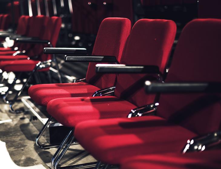 Rows of red seats in a theater