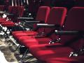 Rows of red seats in a theater